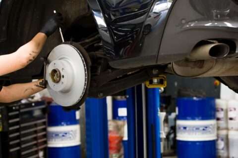Mechanic repairing the brake