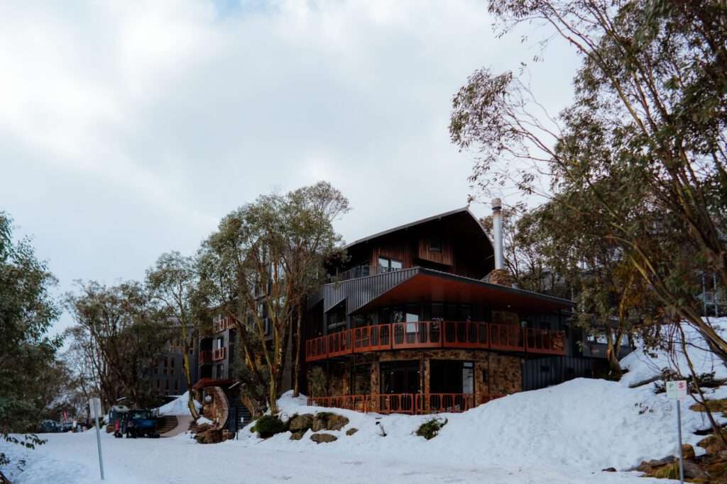 Snow outside Astra Falls Creek, the perfect place to visit on a winter road trip in Victoria