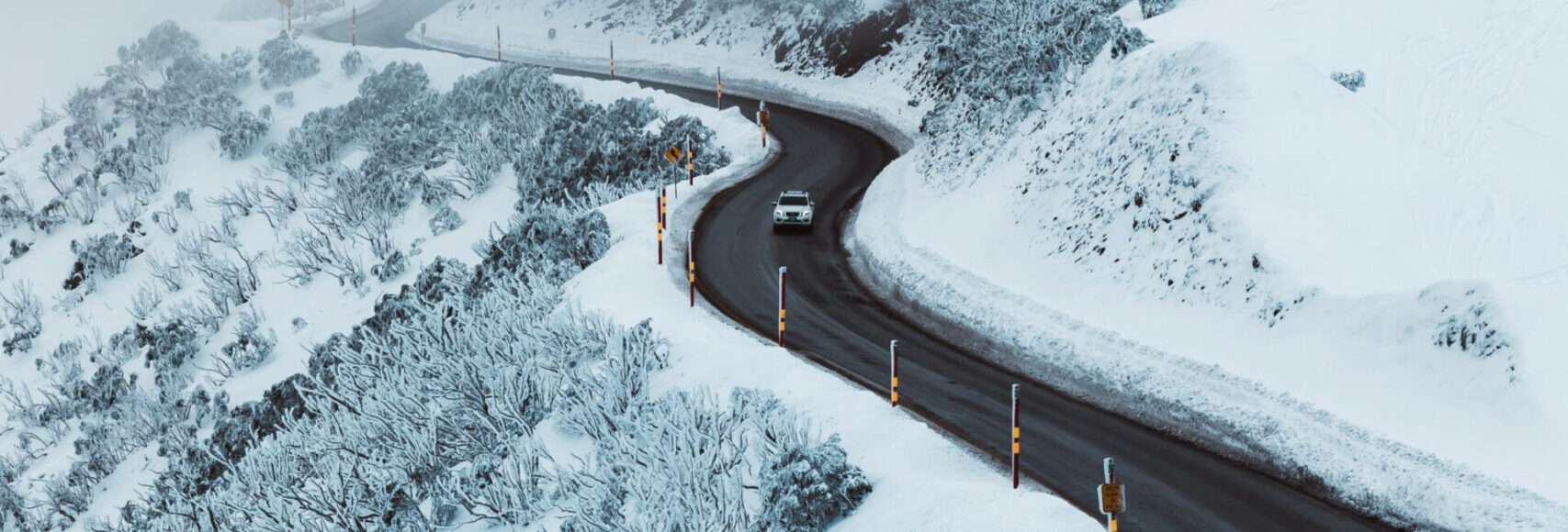 A snowy road that demands some car heating.