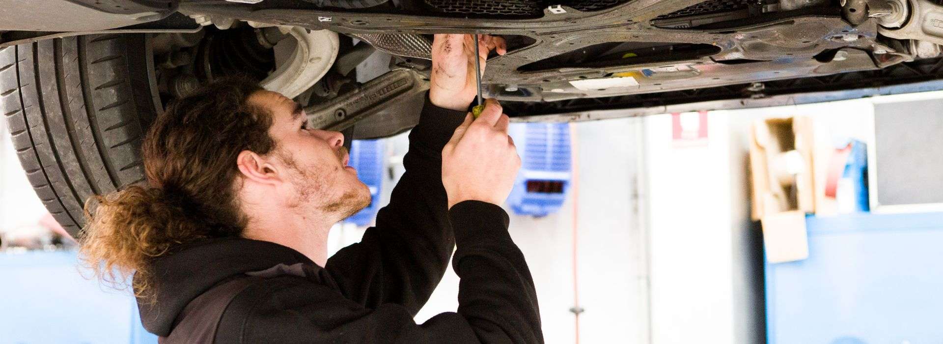 Auto technician working on a vehicle