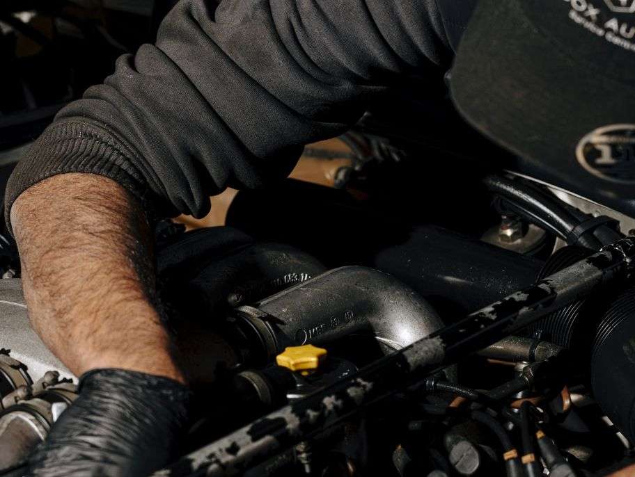 Mechanic working on a car engine