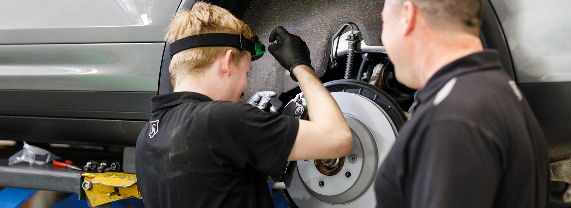 Vehicle mechanic carrying out repairs