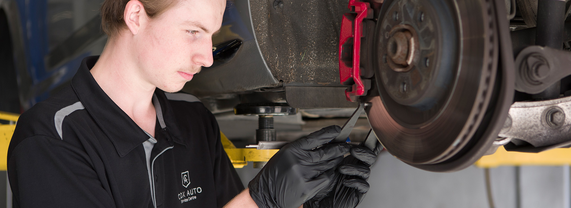Mechanic servicing a car